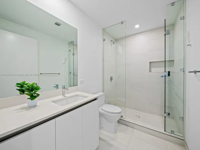wooden floor in an empty room with windows and balcony