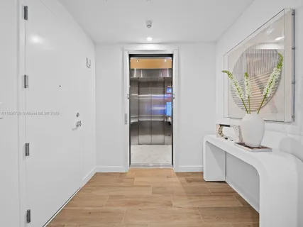 a utility room with sink dryer and washer