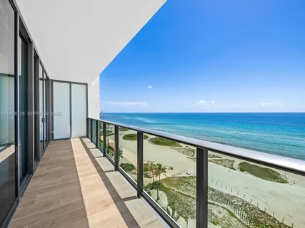 a view of a kitchen with furniture and wooden floor