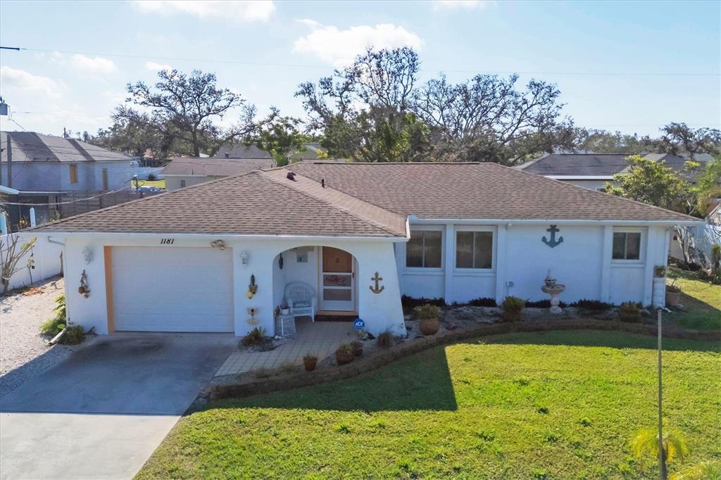 1181 Southland Road Venice, FL 34293 - Photo 1 of 1 a view of a yard in front of a house