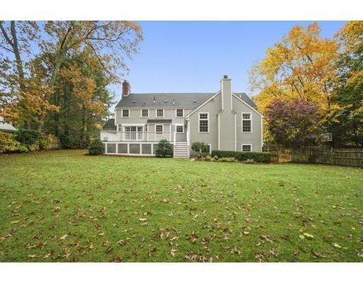 68 Lowell Road Wellesley, MA 02481 - Photo 29 of 31 a front view of a house with a garden