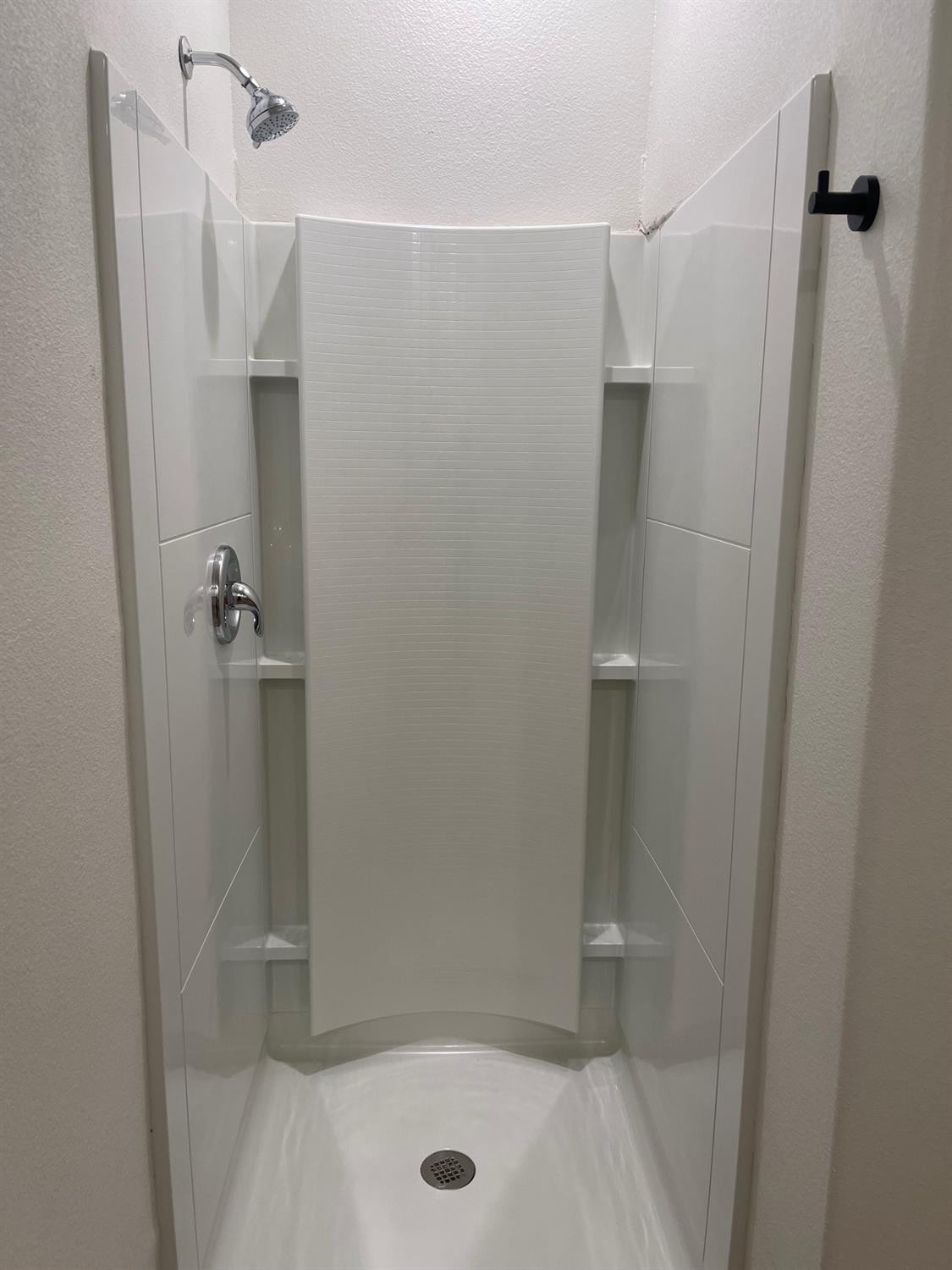 5536 Kemper Street Lubbock, TX 79416 - Photo 10 of 13 a bathroom with a shower