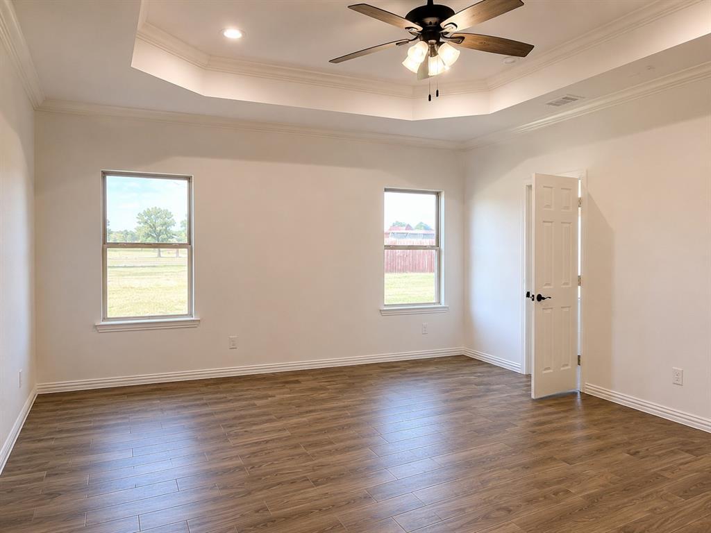8008 County Road 1058 Rice, TX 75155 - Photo 9 of 12 Tray ceiling with recessed lighting
