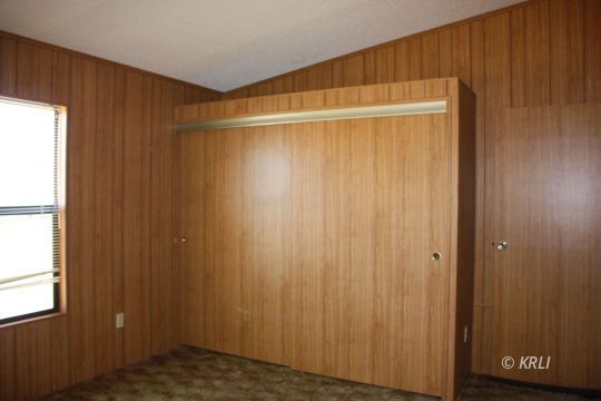 4572 Brooks Road Weldon, CA 93283 - Photo 12 of 26 a view of an empty room with a wooden door