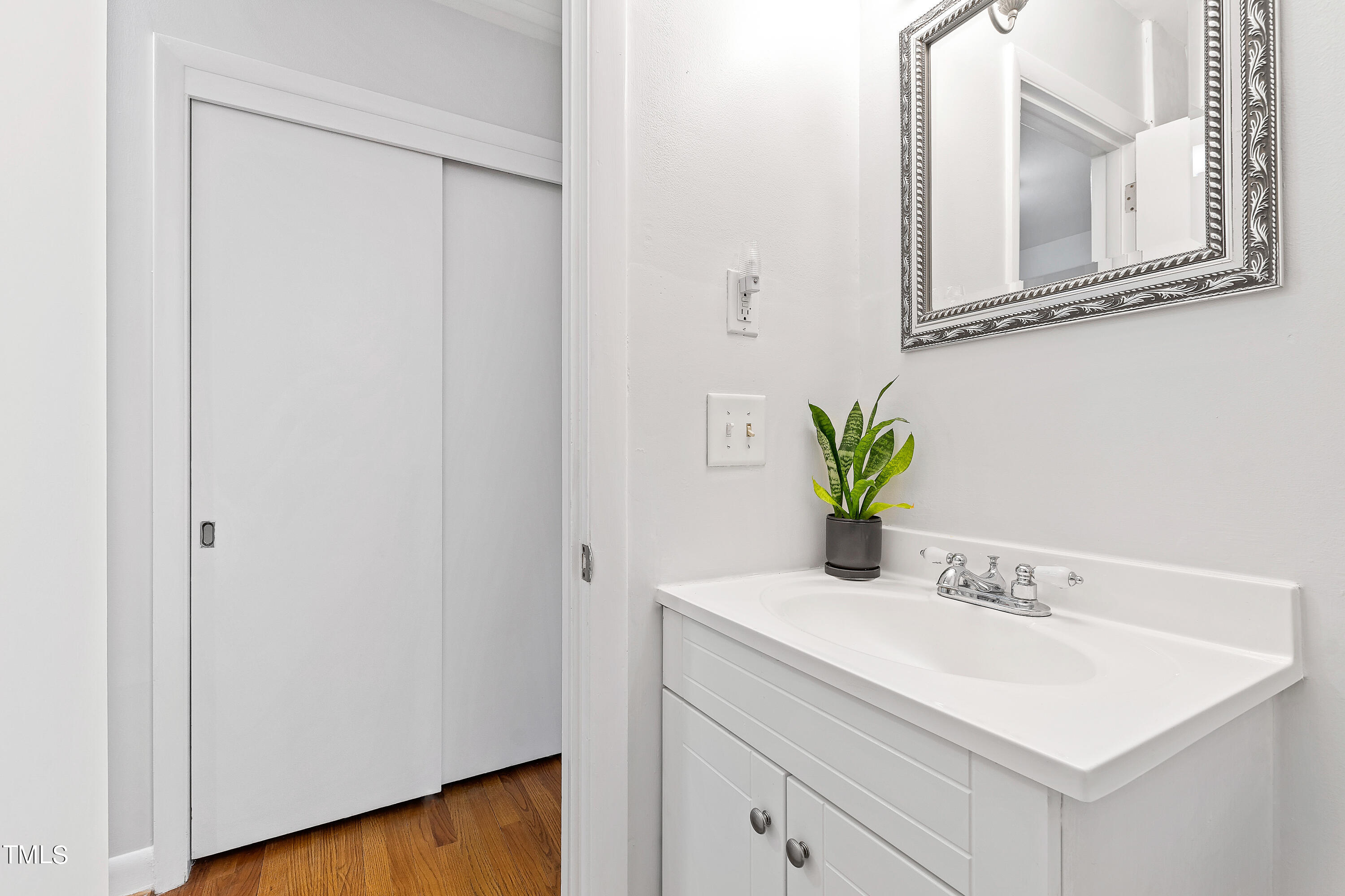 1206 Canterbury Road Raleigh, NC 27608 - Photo 23 of 37 a bathroom with a sink and a mirror