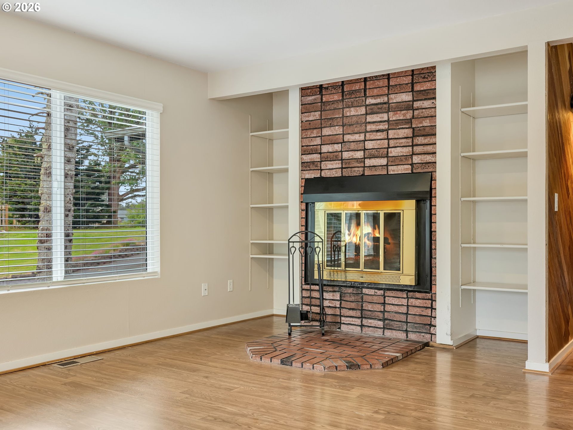 91923 Ridge Road Warrenton, OR 97146 - Photo 6 of 35 an empty room with wooden floor and windows