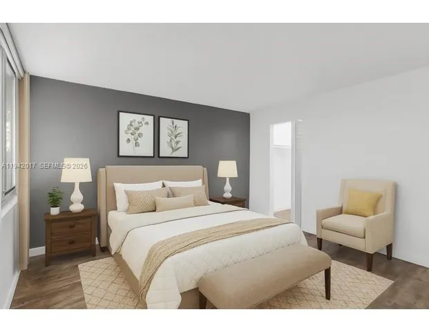 a bedroom with a bed and a couch