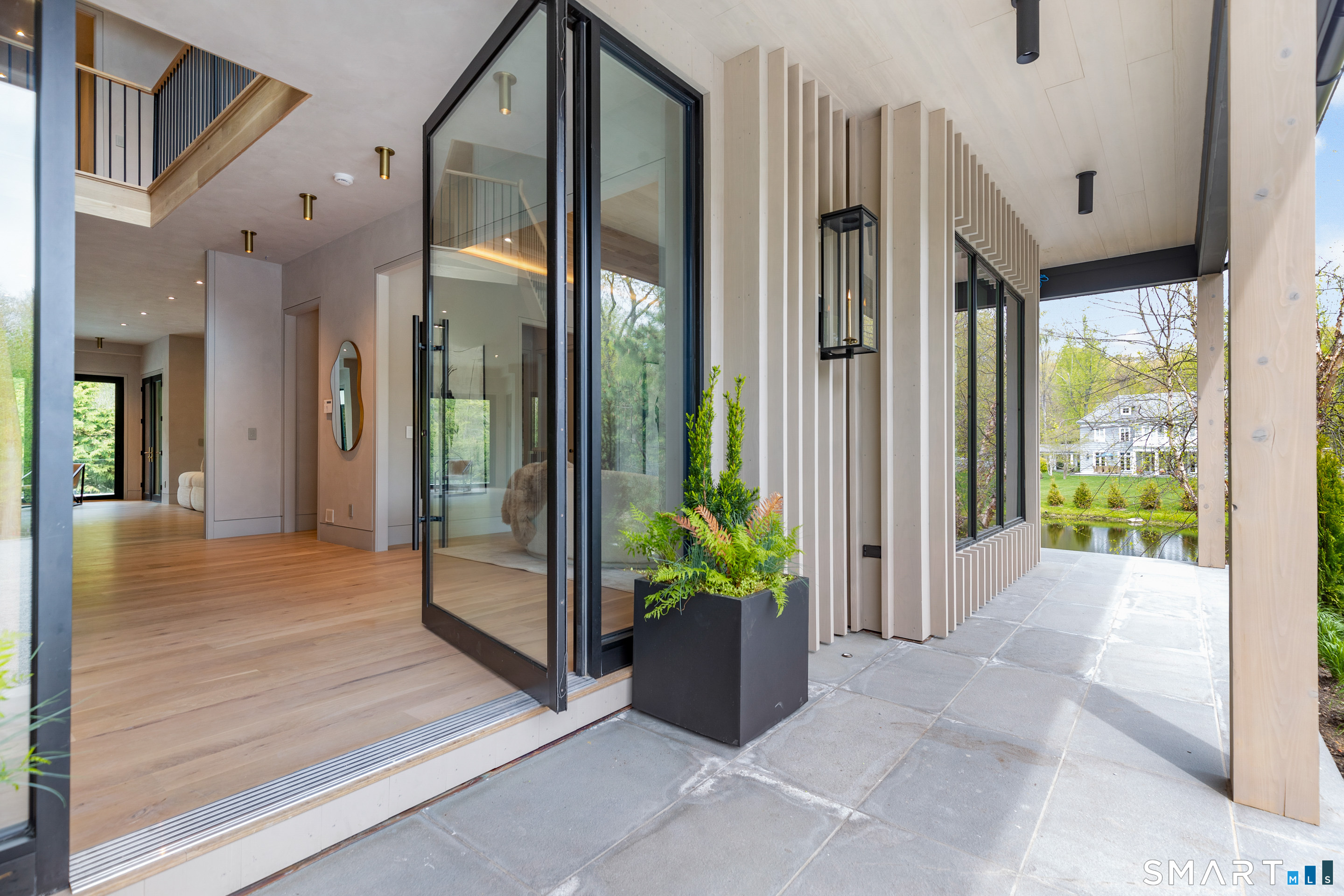 259 Frogtown Road New Canaan, CT 06840 - Photo 5 of 39 a view of a entryway door front of house