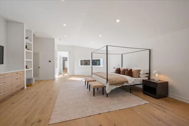 a bedroom with furniture and white walls