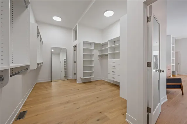a view of empty room with a fireplace