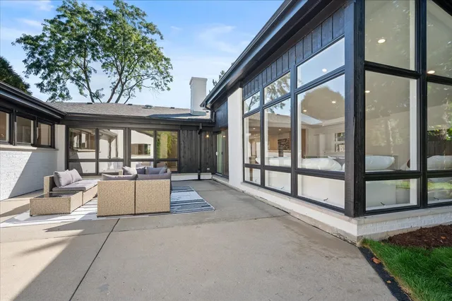 a outdoor living space with furniture and garden view