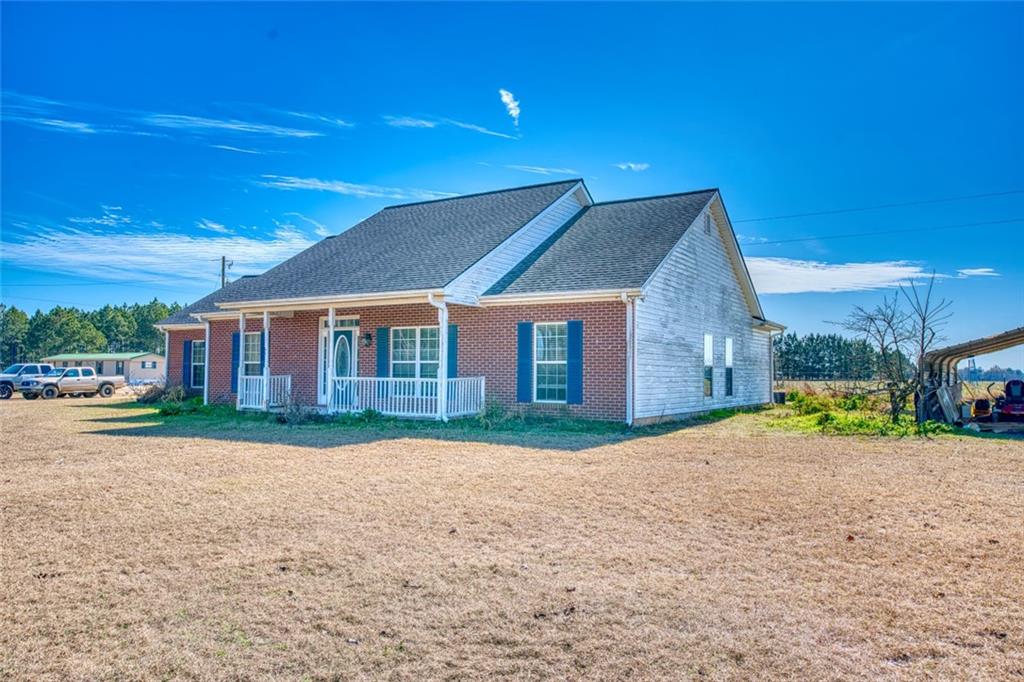 441 Weaver Road Moultrie, GA 31768 - Photo 6 of 48 a yellow house with a yard