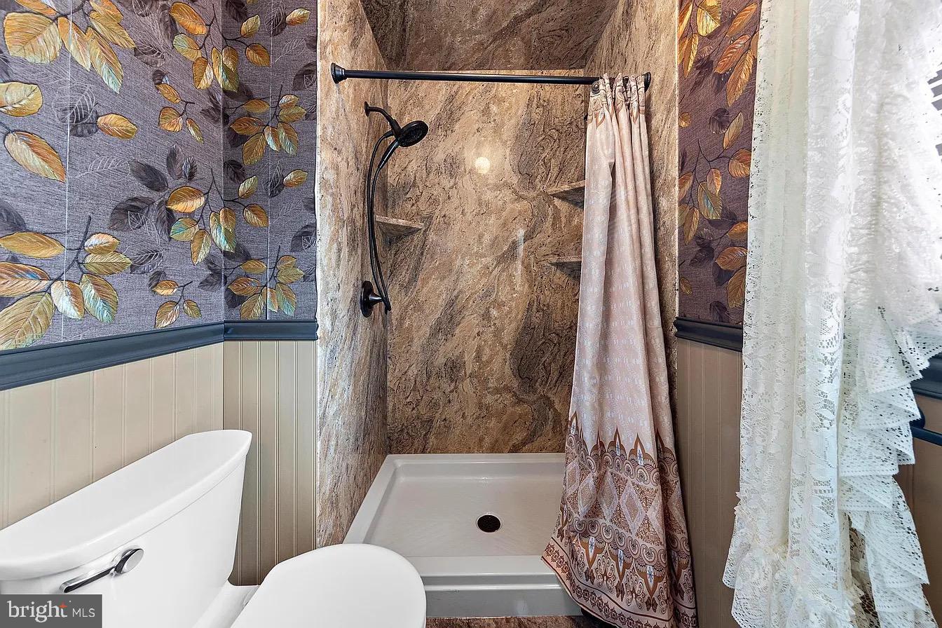 22 Fir Road Manahawkin, NJ 08050 - Photo 23 of 35 a bathroom with a toilet and shower