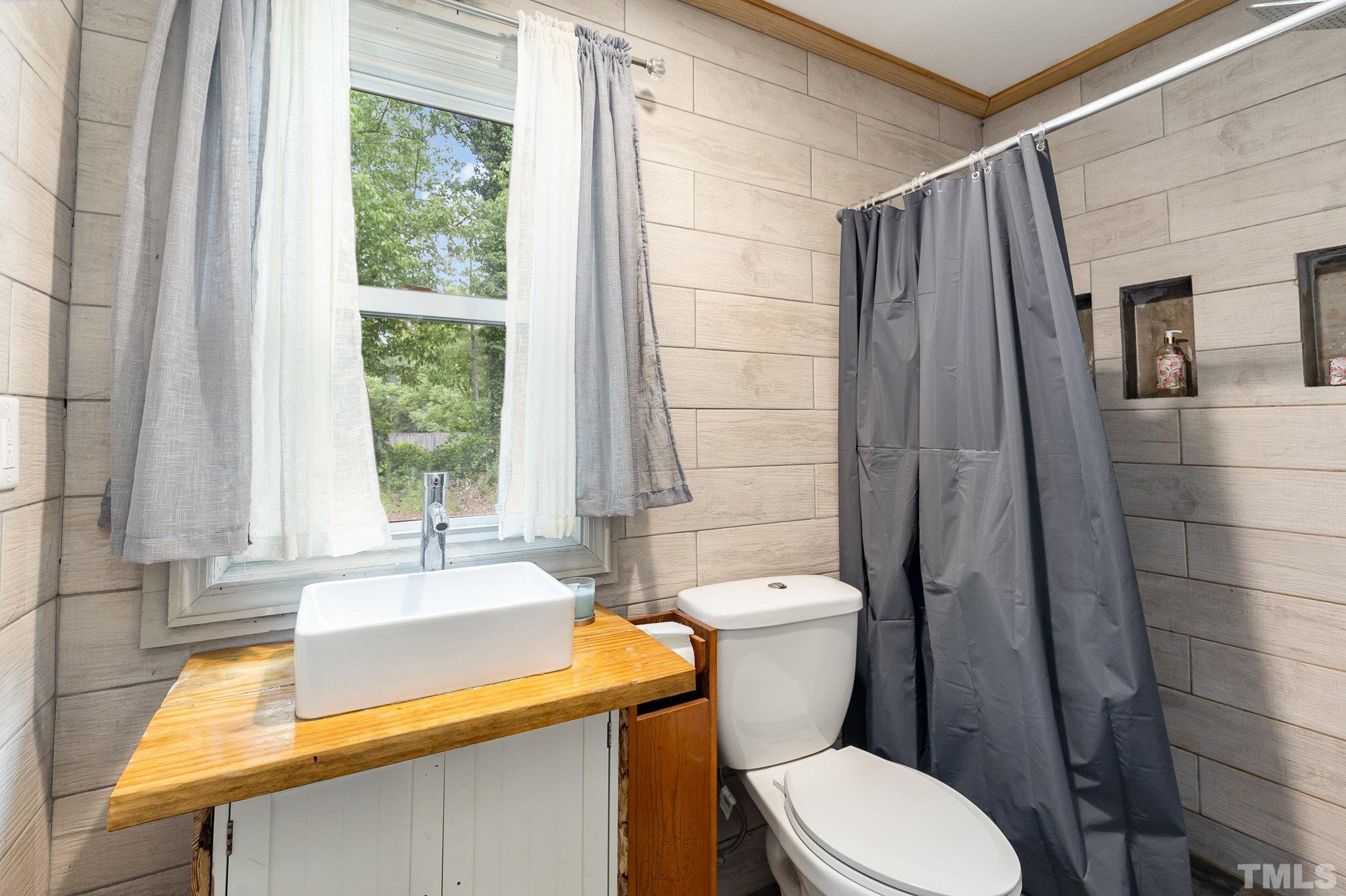 3716 Hayfield Road Wade, NC 28395 - Photo 13 of 24 a bathroom with a sink and a toilet