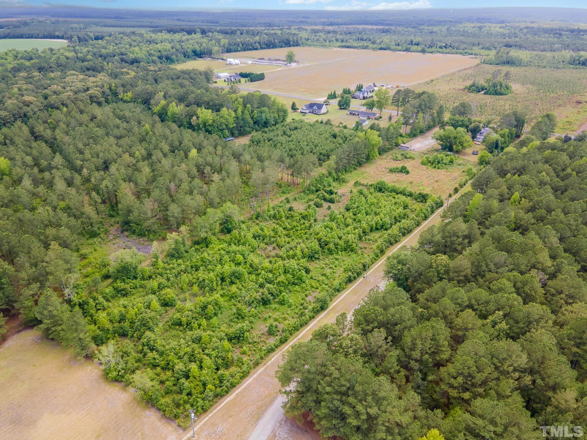3716 Hayfield Road Wade, NC 28395 - Photo 20 of 24 a view of a lake with beach and city view