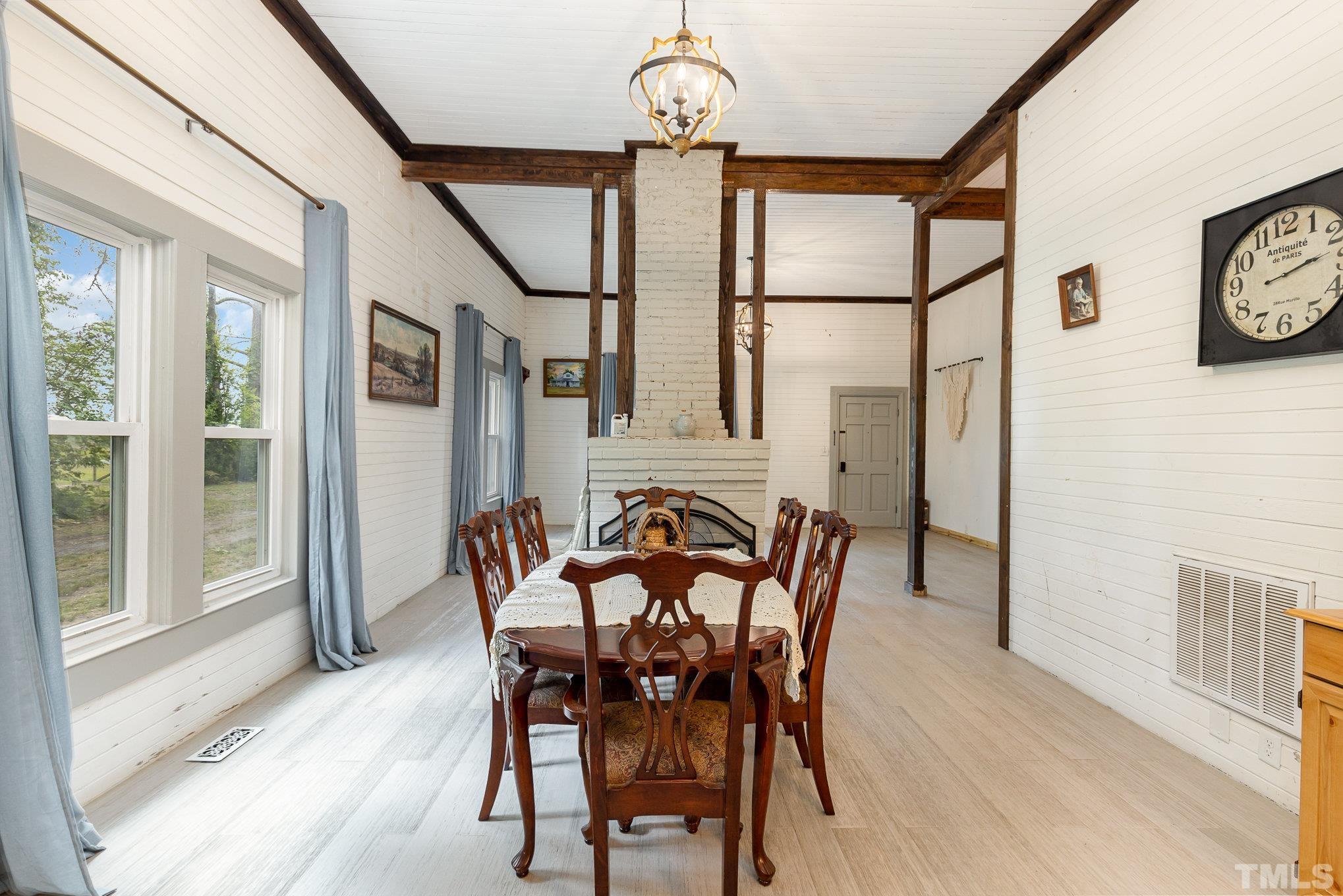 3716 Hayfield Road Wade, NC 28395 - Photo 5 of 24 a view of a dining room with furniture window and wooden floor
