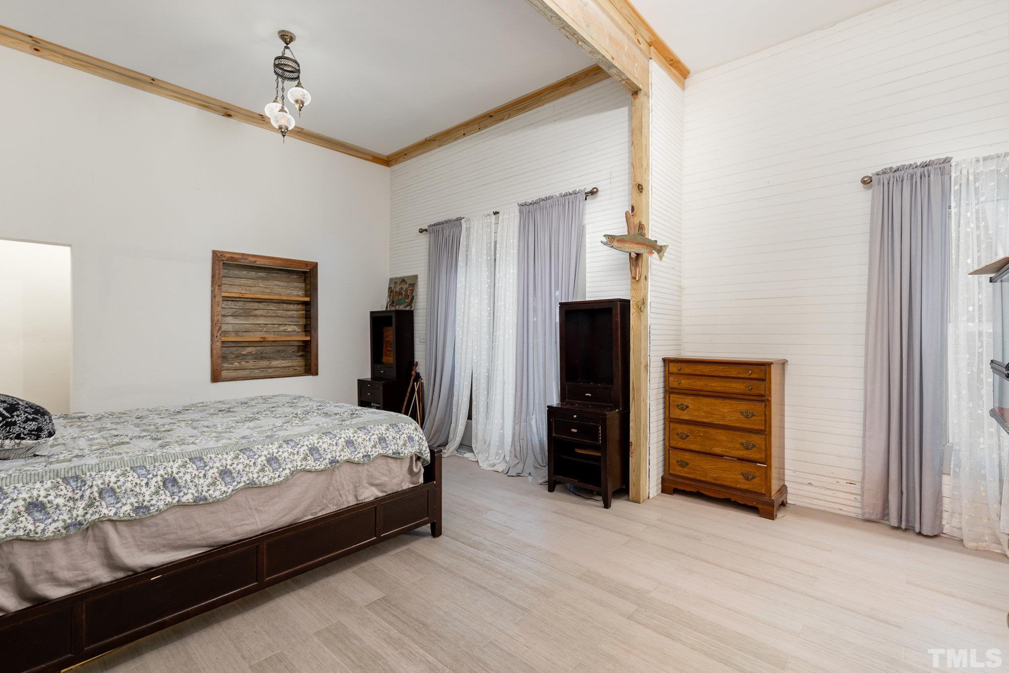 3716 Hayfield Road Wade, NC 28395 - Photo 10 of 24 a bedroom with a bed and a dresser