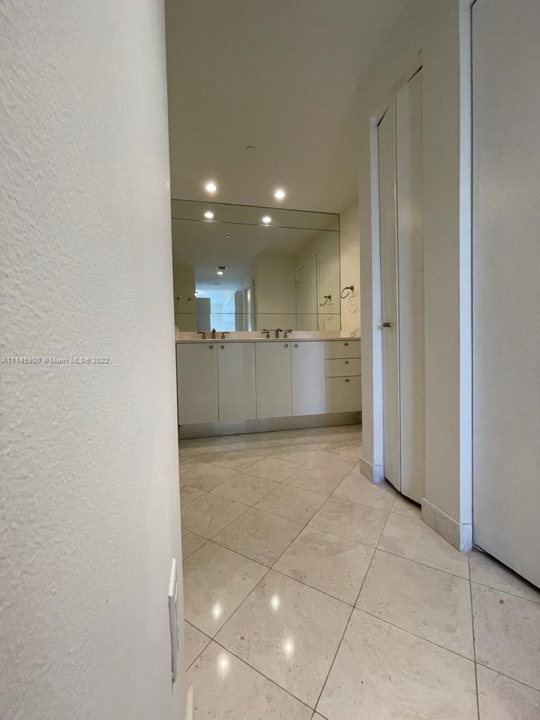 901 Brickell Key Boulevard, Unit 1005 Miami, FL 33131 - Photo 14 of 41 a view of a kitchen with a sink