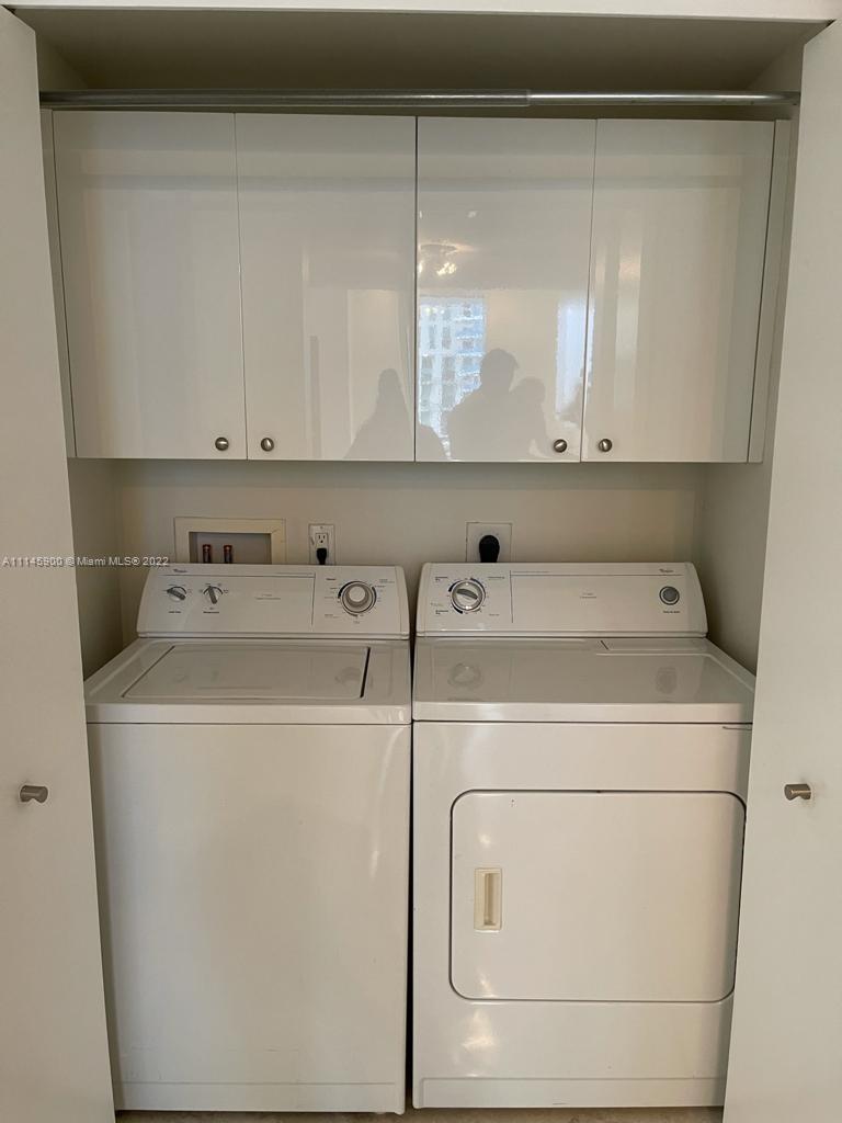 901 Brickell Key Boulevard, Unit 1005 Miami, FL 33131 - Photo 20 of 41 a utility room with dryer and washer