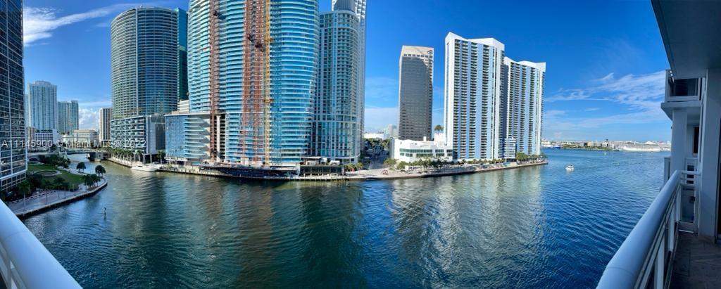 901 Brickell Key Boulevard, Unit 1005 Miami, FL 33131 - Photo 3 of 41 a view of swimming pool with outdoor seating