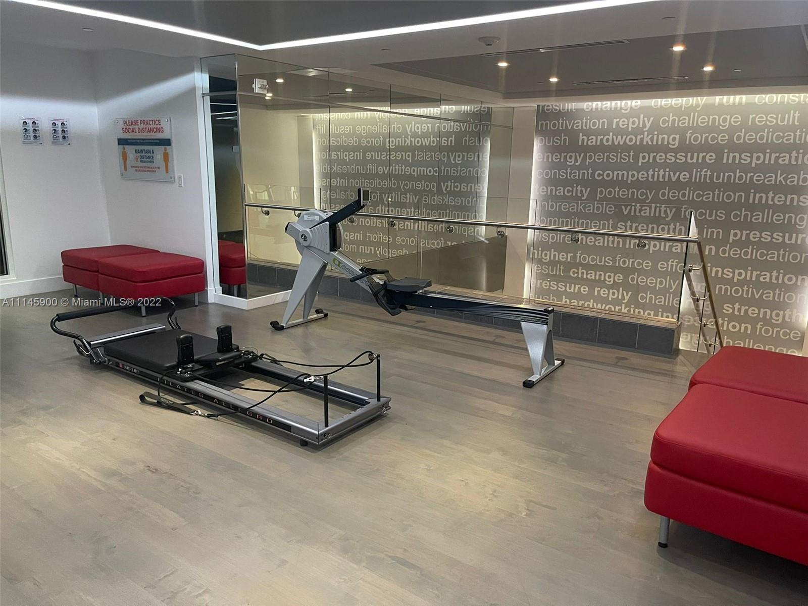 901 Brickell Key Boulevard, Unit 1005 Miami, FL 33131 - Photo 35 of 41 a room with gym equipment