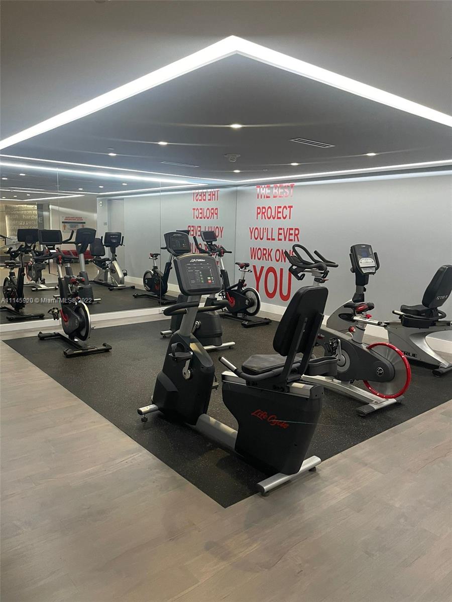 901 Brickell Key Boulevard, Unit 1005 Miami, FL 33131 - Photo 37 of 41 a view of a room with gym equipment