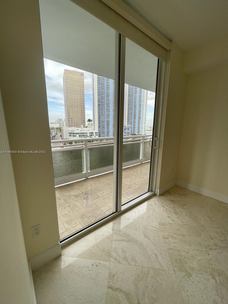 901 Brickell Key Boulevard, Unit 1005 Miami, FL 33131 - Photo 8 of 41 a view of an empty room and window