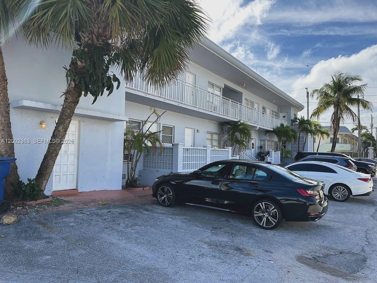 a view of a car parked in front of a house