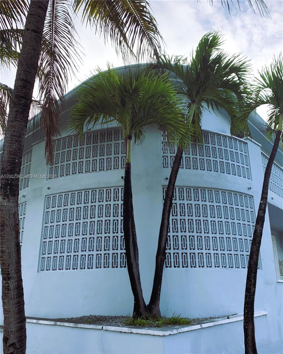 8545 Harding Avenue, Unit 5 Miami Beach, FL 33141 - Photo 3 of 10 a view of outdoor space with deck and lake view