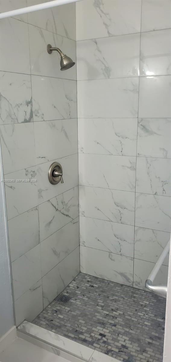 8545 Harding Avenue, Unit 5 Miami Beach, FL 33141 - Photo 9 of 10 a bathroom with a shower