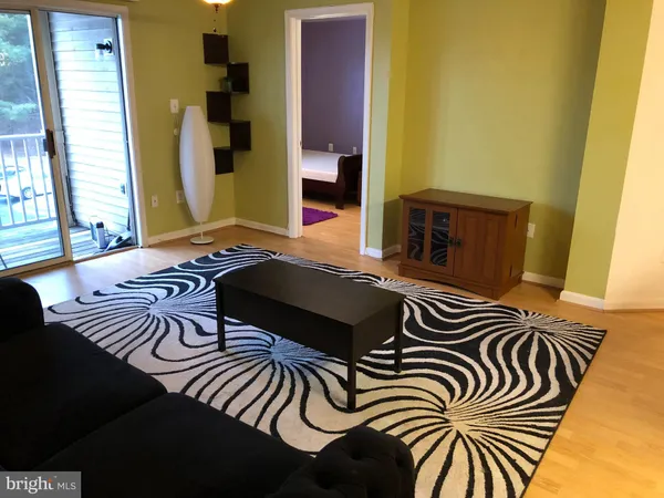 a view of a livingroom with wooden floor