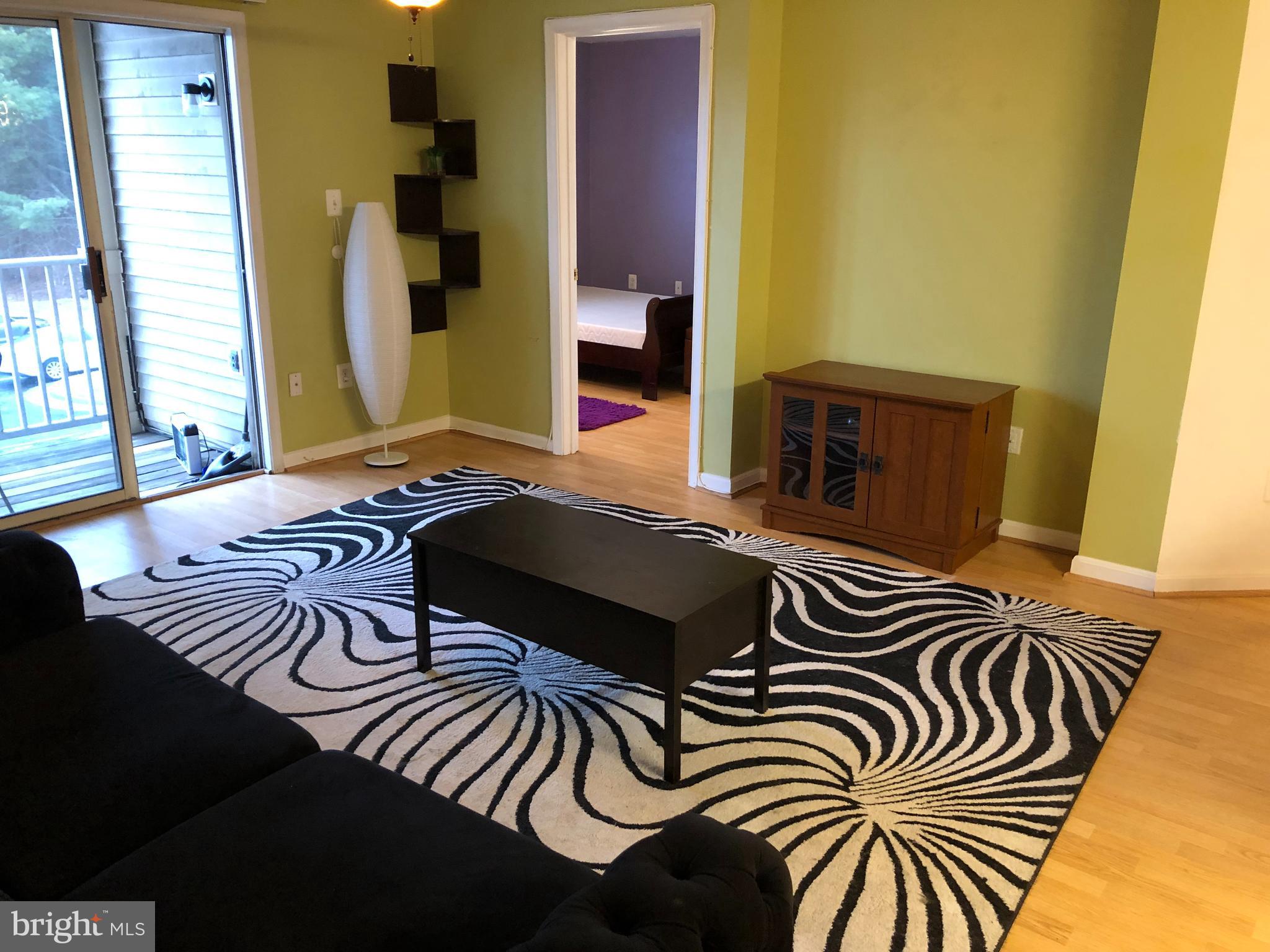 1055 Gardenview Loop, Unit 304 Woodbridge, VA 22191 - Photo 16 of 70 a bedroom with a bed and a window