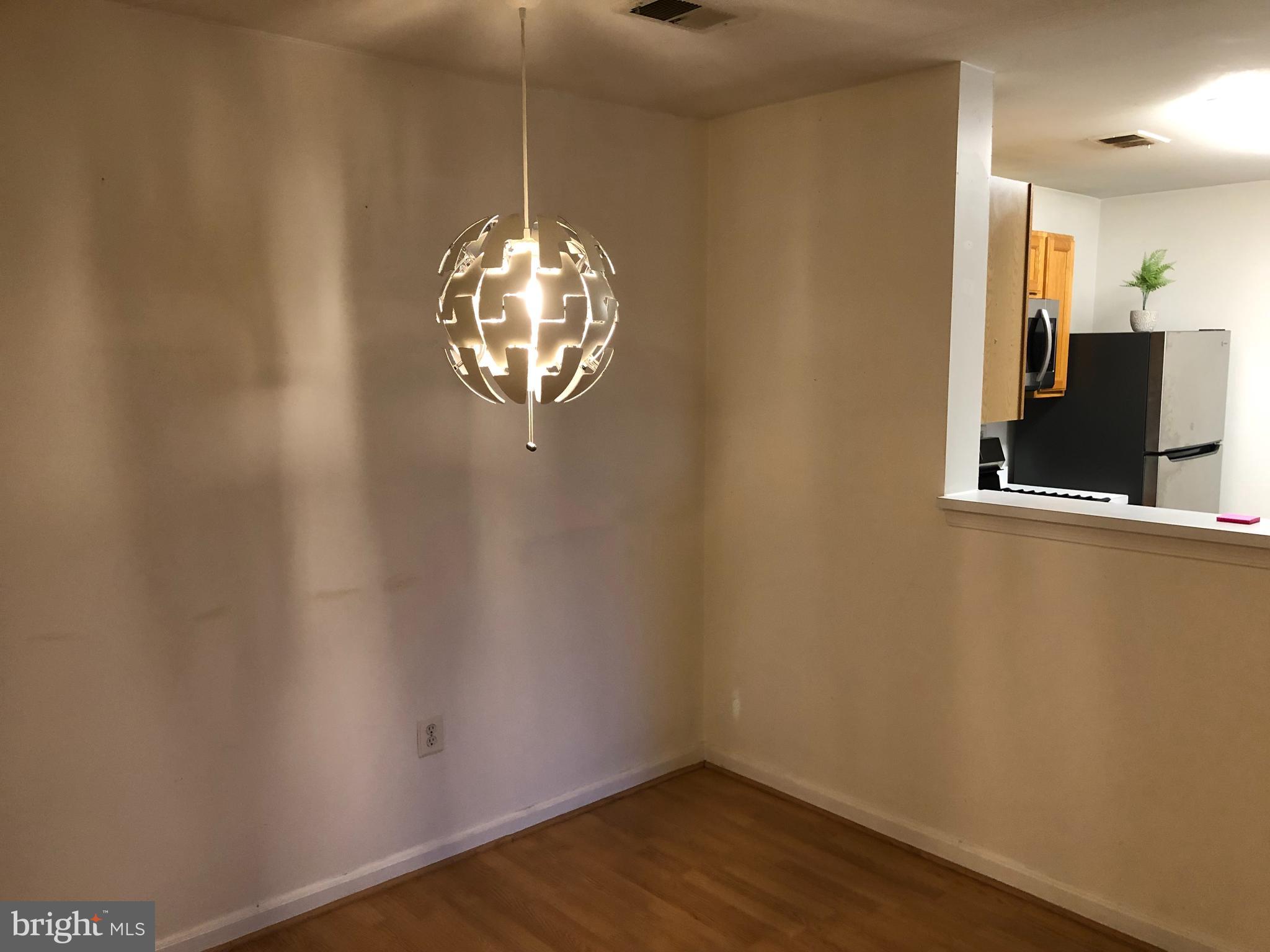 1055 Gardenview Loop, Unit 304 Woodbridge, VA 22191 - Photo 18 of 70 a view of a livingroom with wooden floor