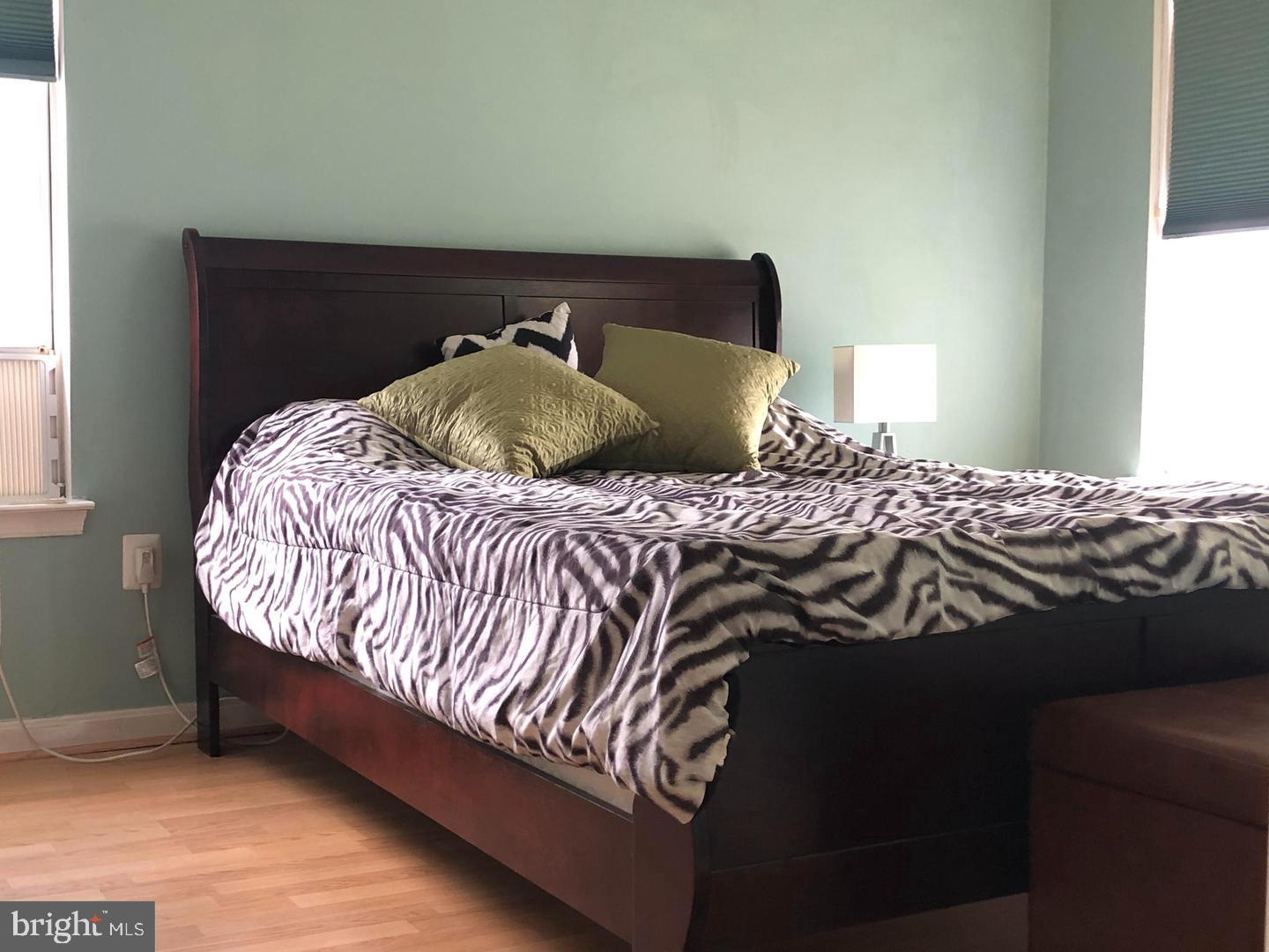 1055 Gardenview Loop, Unit 304 Woodbridge, VA 22191 - Photo 25 of 70 a bedroom with a bed and a window