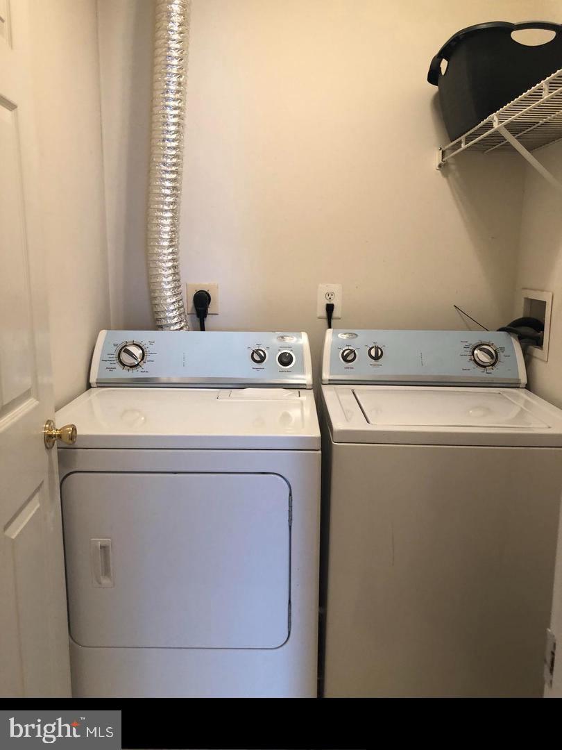 1055 Gardenview Loop, Unit 304 Woodbridge, VA 22191 - Photo 37 of 70 a utility room with dryer and washer