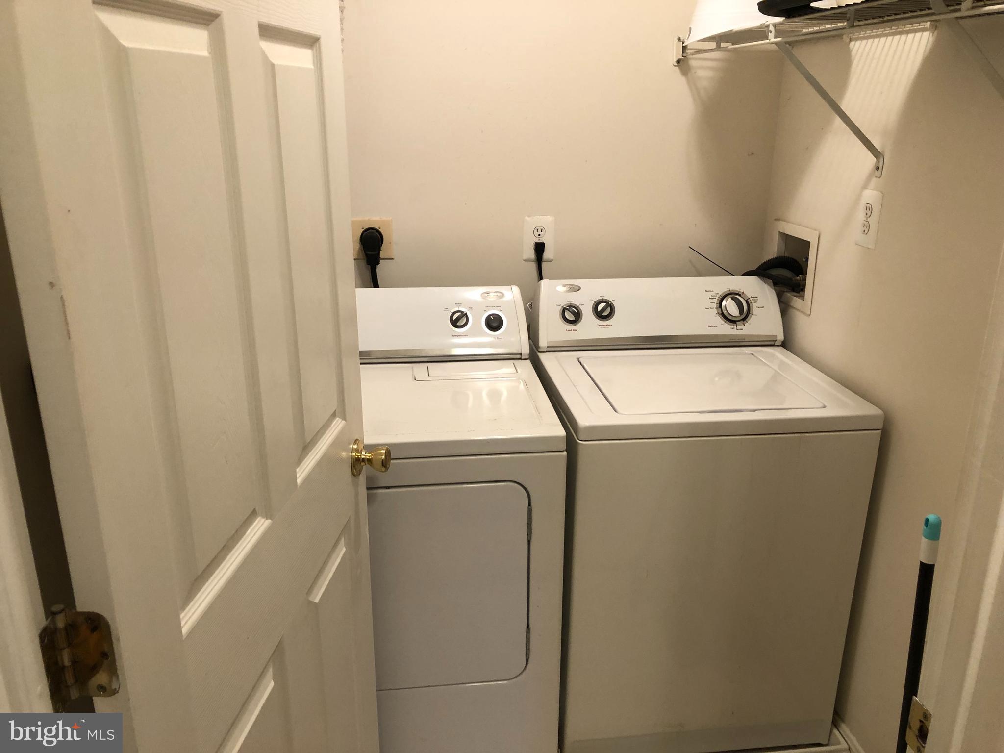 1055 Gardenview Loop, Unit 304 Woodbridge, VA 22191 - Photo 38 of 70 a utility room with dryer and washer