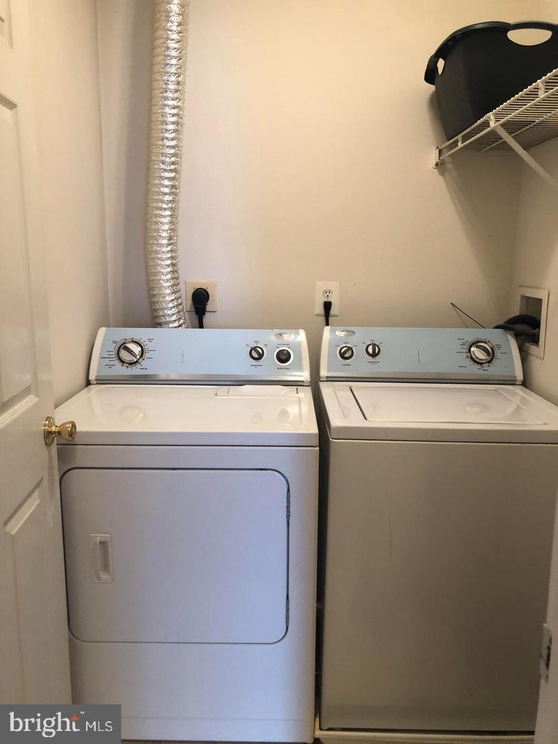 1055 Gardenview Loop, Unit 304 Woodbridge, VA 22191 - Photo 39 of 70 a utility room with dryer and washer