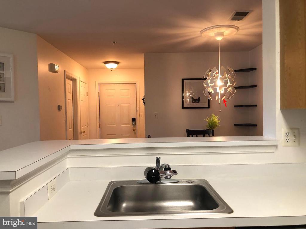 1055 Gardenview Loop, Unit 304 Woodbridge, VA 22191 - Photo 42 of 70 Modern kitchen with stylish lighting.
