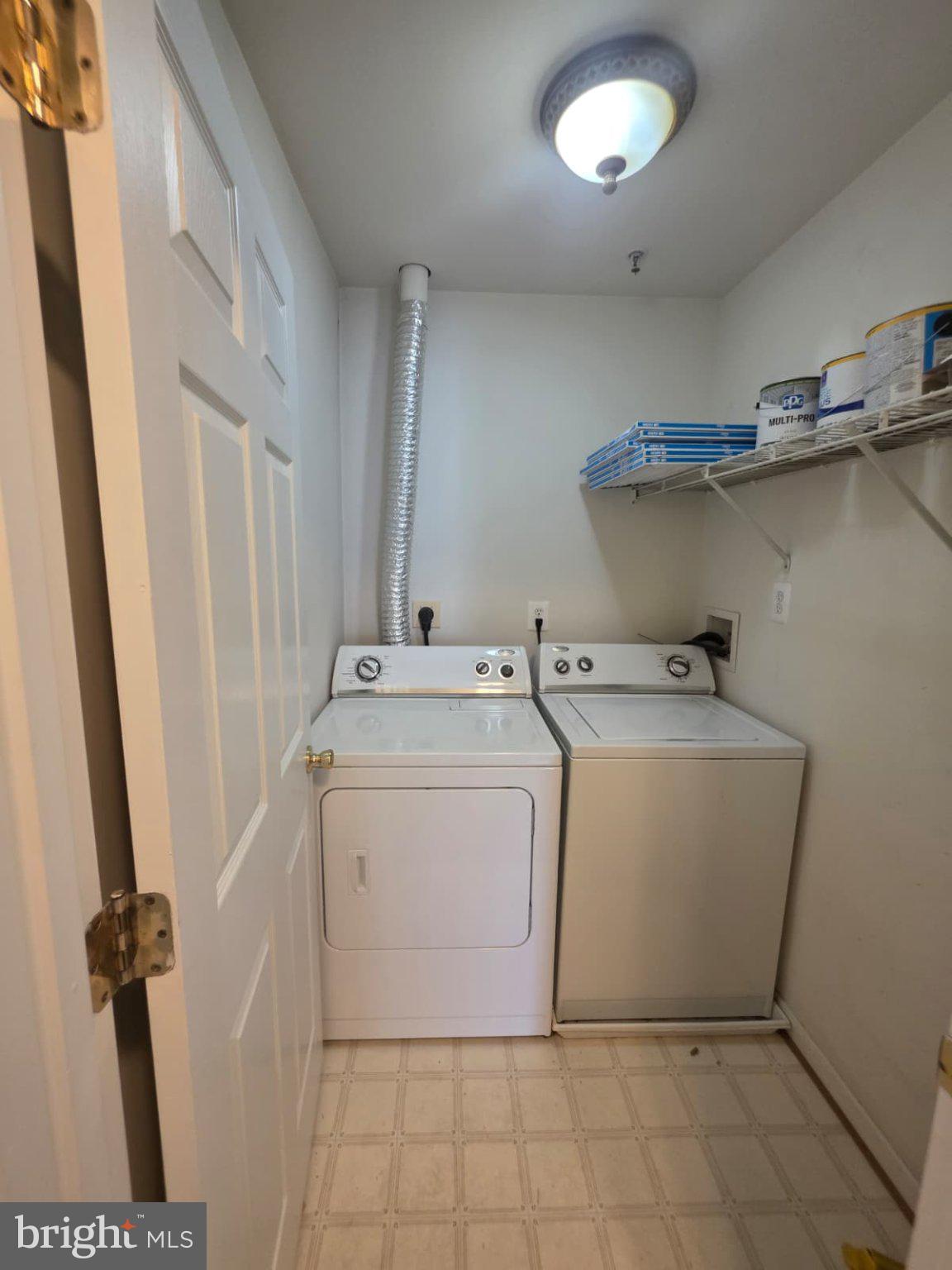 1055 Gardenview Loop, Unit 304 Woodbridge, VA 22191 - Photo 58 of 70 a utility room with dryer and washer