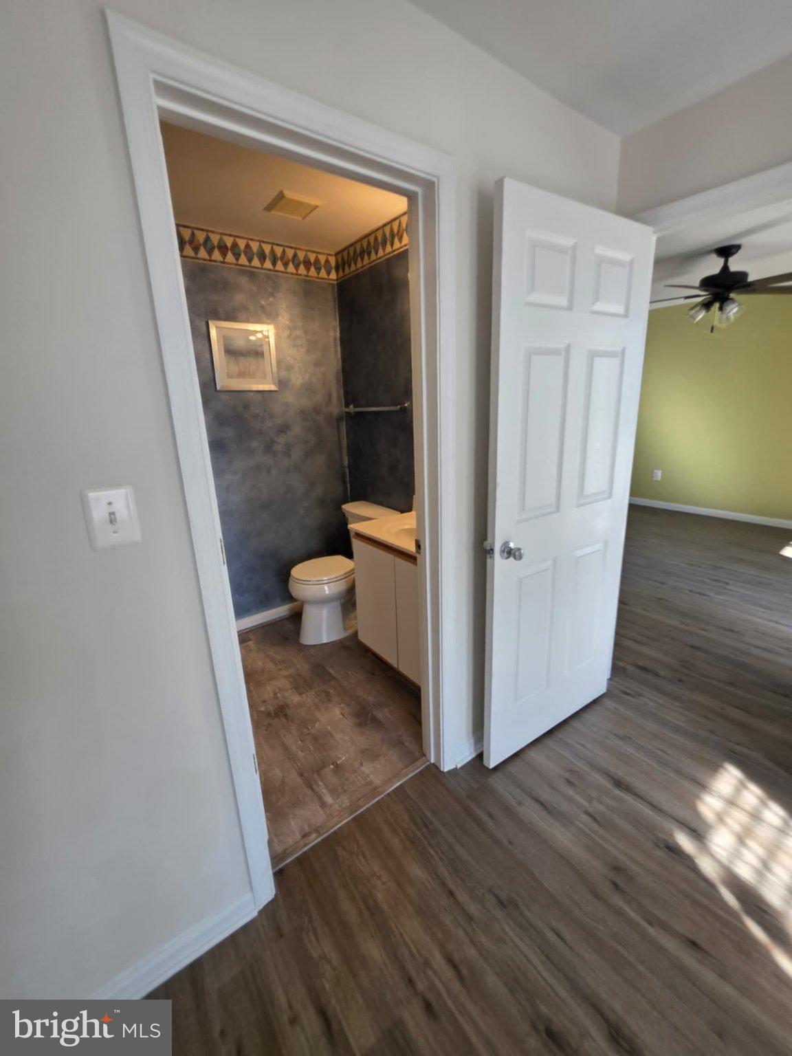 1055 Gardenview Loop, Unit 304 Woodbridge, VA 22191 - Photo 62 of 70 a view of a hallway with wooden floor and a hallway