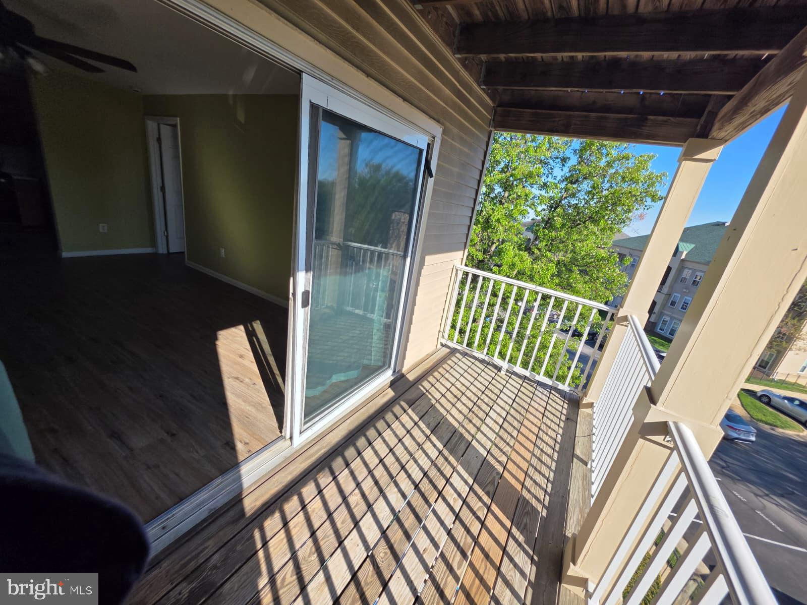 1055 Gardenview Loop, Unit 304 Woodbridge, VA 22191 - Photo 66 of 70 Sunny balcony with scenic views.