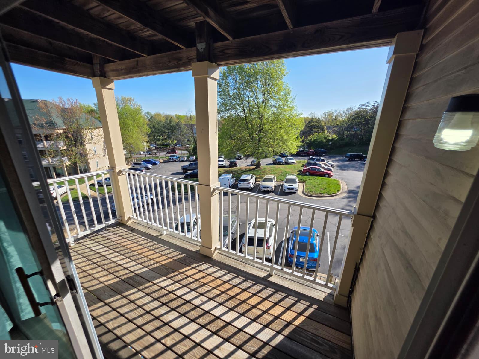 1055 Gardenview Loop, Unit 304 Woodbridge, VA 22191 - Photo 67 of 70 a view of a balcony with wooden floor