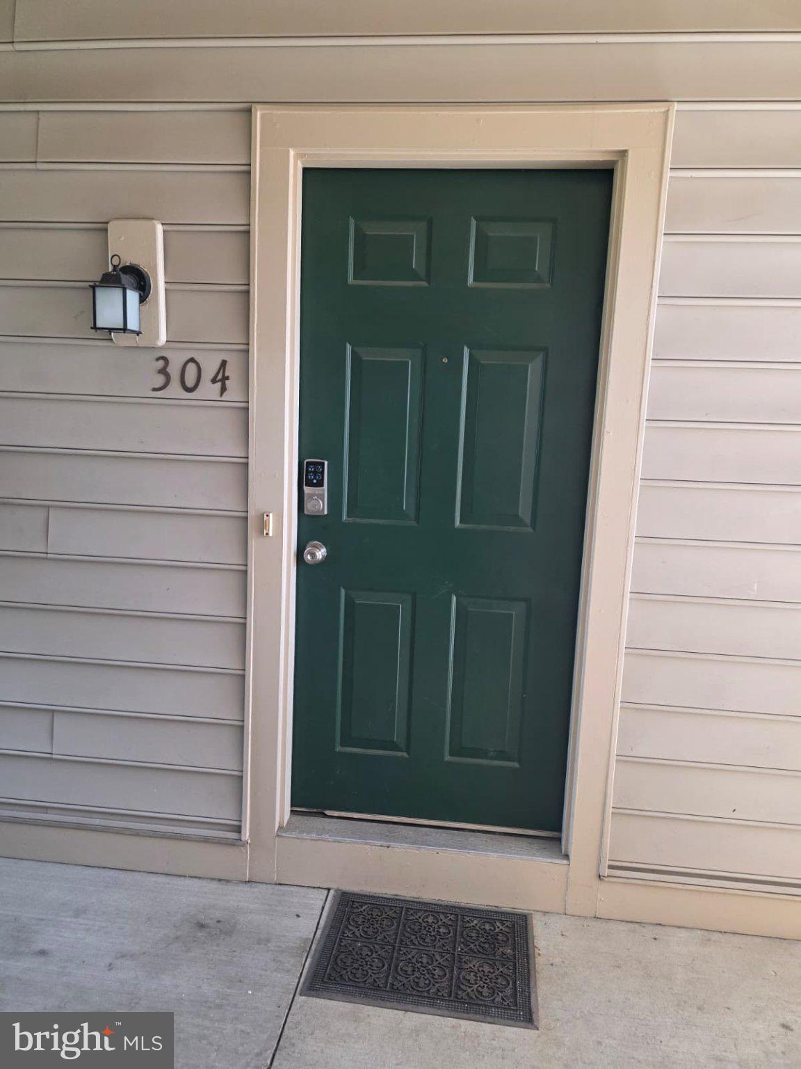 1055 Gardenview Loop, Unit 304 Woodbridge, VA 22191 - Photo 69 of 70 Charming green door invites you in.