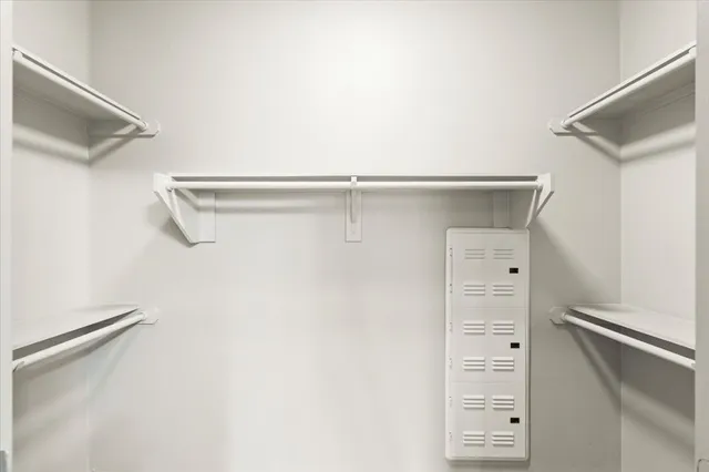 a view of a lake with couches in the patio