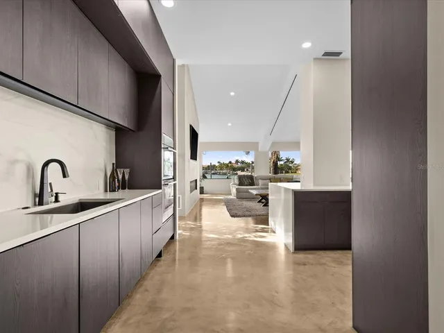 a view of a lake with a table and chairs