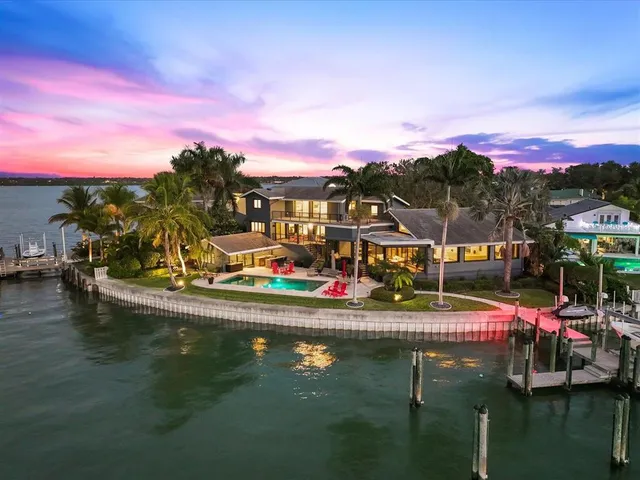 a view of a dining room with furniture and a floor to ceiling window