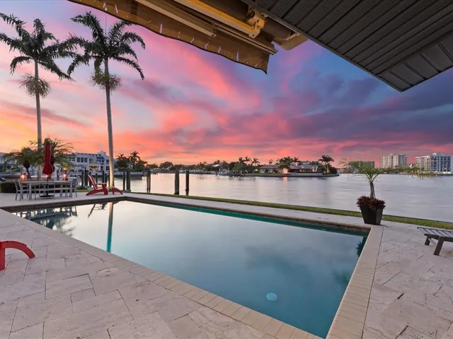 a view of staircase with wooden floor and white walls