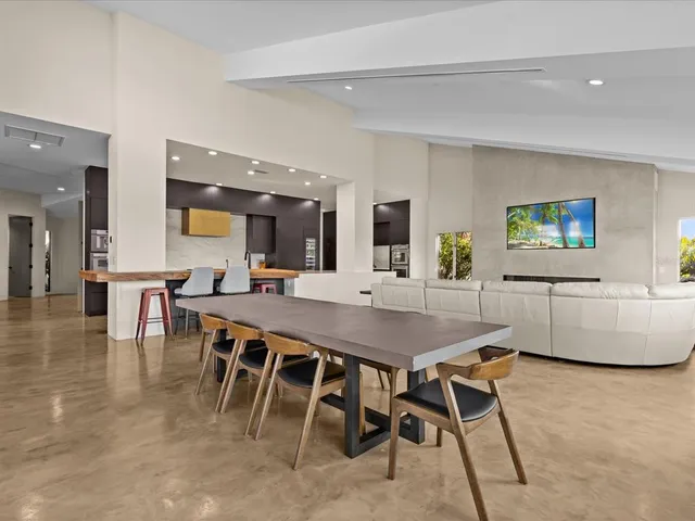 a room with gym equipment and large mirror