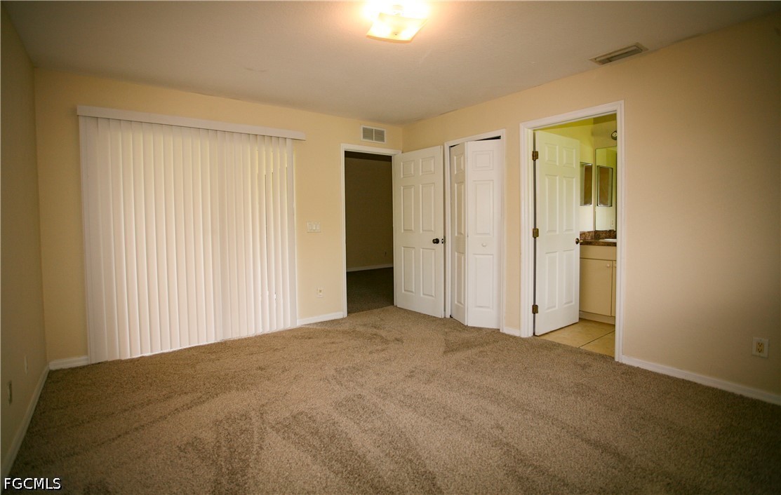 4614 25th Street Southwest Lehigh Acres, FL 33973 - Photo 7 of 15 a view of an empty room and closet area