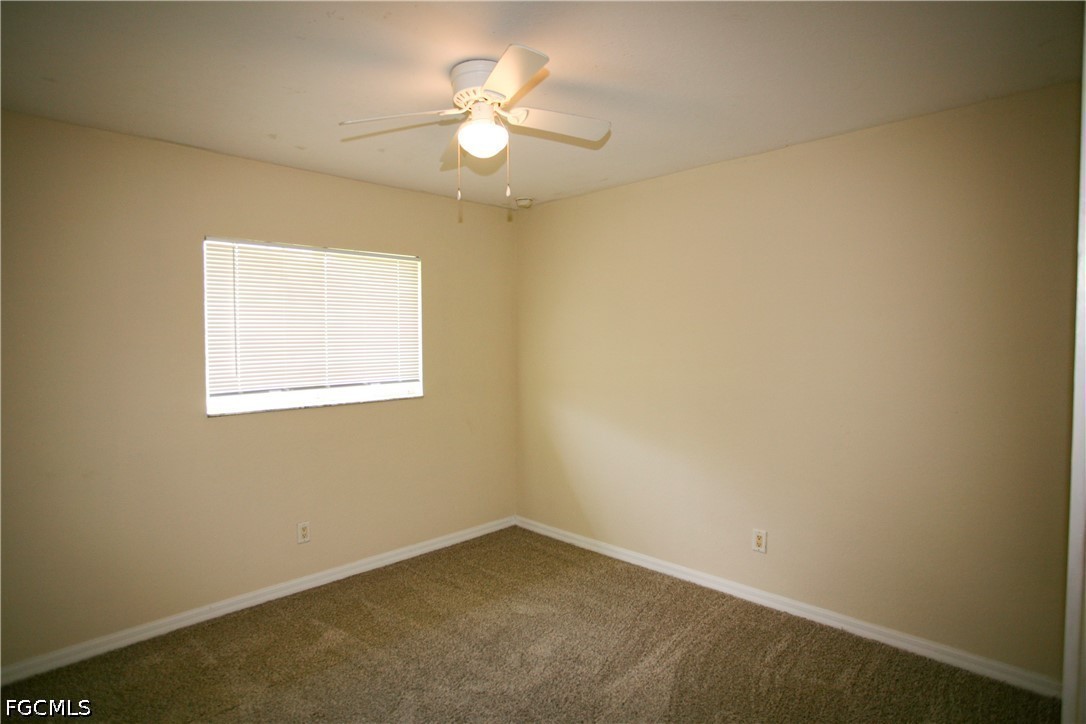 4614 25th Street Southwest Lehigh Acres, FL 33973 - Photo 10 of 15 an empty room with a window